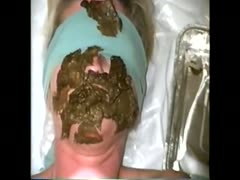 Blonde wears her blindfold and lets a man shit on her face